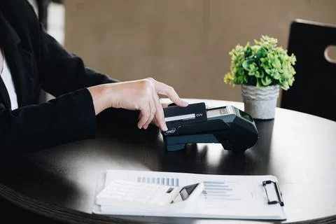 Safe technology concept from using credit card, employee is holding custome.. Stock Photos