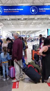 Safe tourism precautions and queue to boarding in airport Stock Photos
