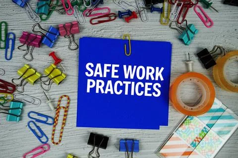 Safe Work Practices text on stick note with stationery on concrete background Stock Photos