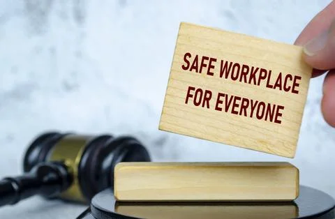 Safe workplace for everyone text written on wooden board with lawyer gavel .. Stock Photos