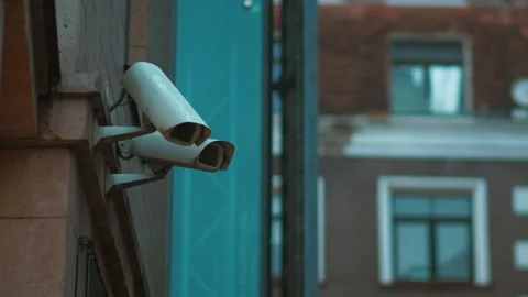 Safeguarding tradition: CCTV security cameras keep a watchful eye on the Stock Footage 271156980