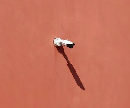 Safety camera isolated on the wall. Stock Photos