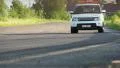Safety car driving desert circuit, approaching, taking turn HD Footage