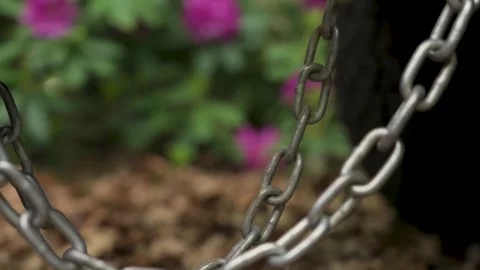Safety chains securing a trailer to the frame of a vehicle. Stock Footage 336561033