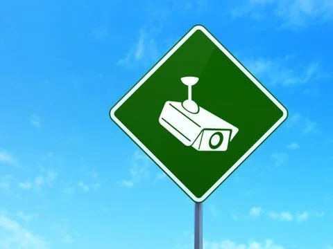 Safety concept: Cctv Camera on road sign background Illustrazione stock