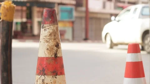 Safety cones at an intersection with traffic, in a small town, Northern Thailand Stock Footage 94859380