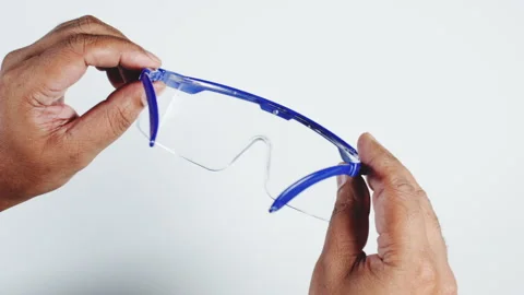 Safety Goggles In man's Hands Stock Footage 248754244