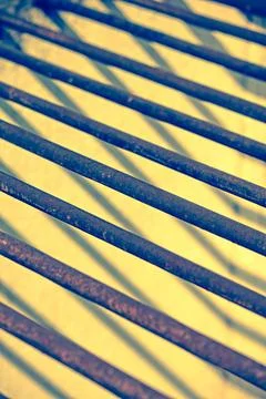Safety Grill with shadow creating a pattern Safety Grill with shadow creat... Stock Photos