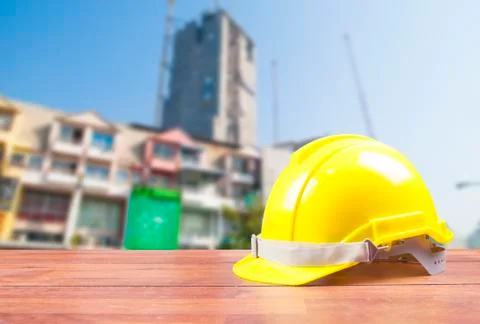 Safety helmet with construction site background Stock Photos