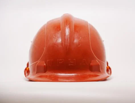 Safety helmet placed on a flat surface ready for construction work Stock Photos