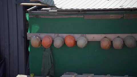 Safety Helmets Hanging in a Row After Work 스톡 동영상 314134294