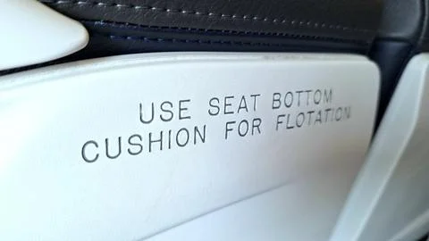 Safety instruction for using a cushion for flotation. Stock Photos