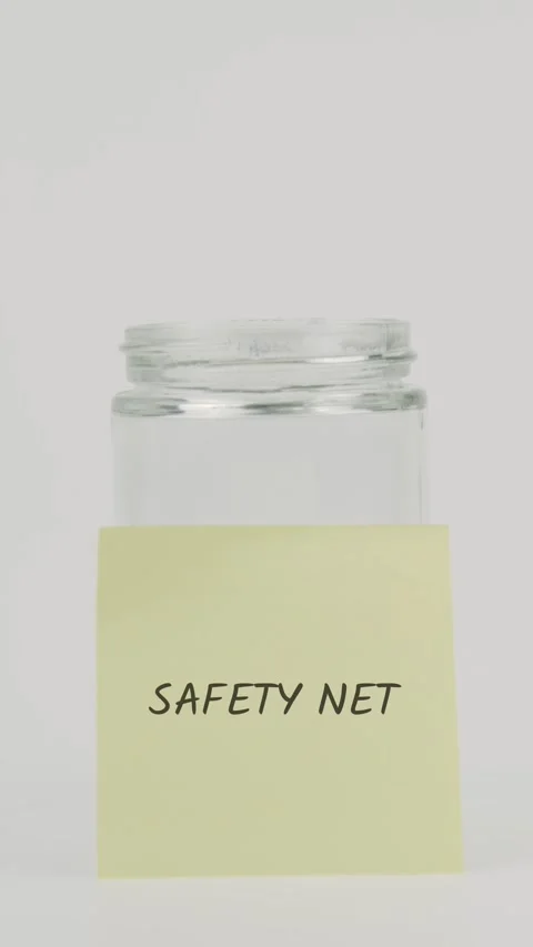 Safety net text or word on yellow sticky note attached to glass jar Stock Footage 311783333