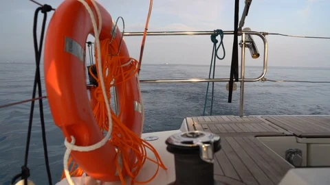 Safety ring on a deck of motoring sailing boat Stock Footage 120233771