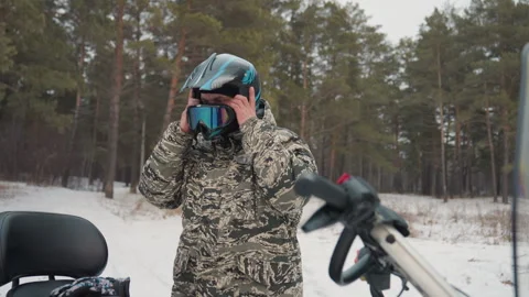Safety routine performed before beginning snowmobile adventure. Person checks Stock Footage 345146776