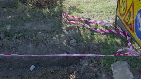 Safety Tape Blocking Access Around Temporary Roadwork Area Video stock 346992003