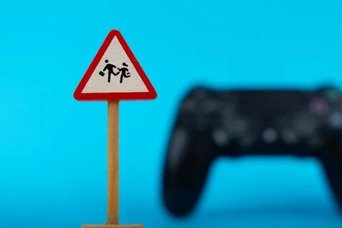 Safety Warning and Game Controller Stock Photos
