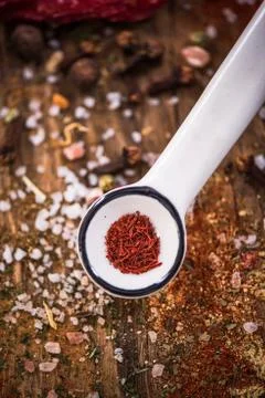 Saffron in ceramic spoon Stock Photos