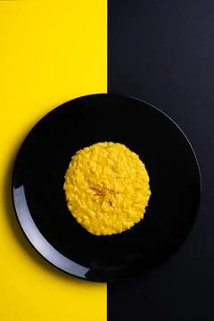 Saffron risotto on dark background Stock Photos