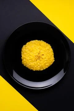 Saffron risotto on dark background Stock Photos