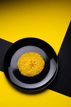 Saffron risotto on dark background Stock Photos