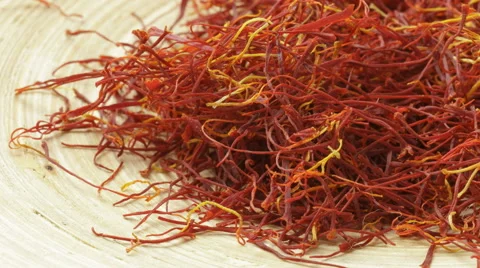 Saffron strands on a wooden surface tracking shot Stock Footage