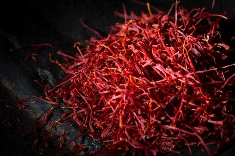 Saffron threads on dark background Stock Photos