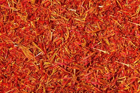 Saffron threads on dark background. Stock Photos