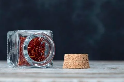 Saffron threads in an open jar Stock Photos