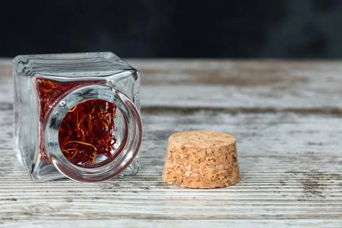 Saffron threads in an open jar Stock Photos