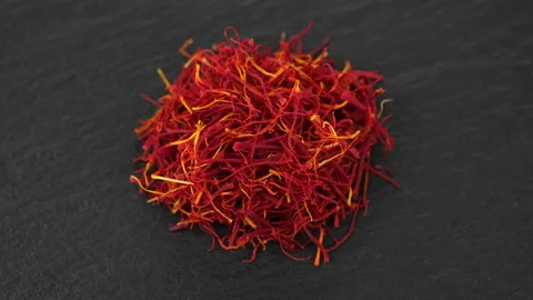 Saffron threads spice isolated on dark stone plate, rotate Stock-Footage 197505152