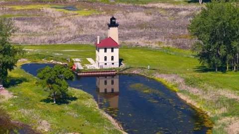 Saginaw river range Lighthouse aerial view by Lake Huron Stock Footage 340952896