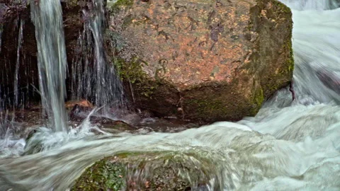 Sagittario river flows fast between rocks and woods near the Cavuto Springs Stock Footage 246036178
