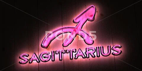 Sagittarius zodiac sign in pink neon light Stock Illustration