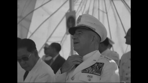 SAIGON - 1957: Command dais - Decorated soldier salutes near microphone Stock Footage 344502181