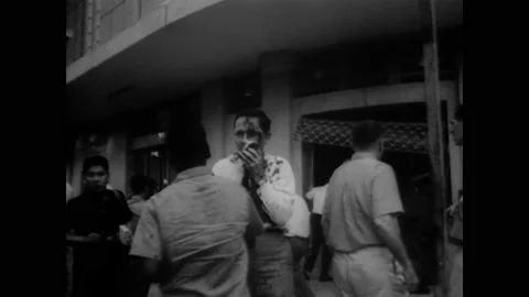 SAIGON - 1965 - Initial cleanup work begins on the US Embassy in Saigon after a Stock Footage 259630428