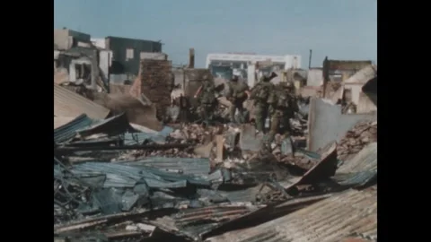 SAIGON - 1968: Shadowed position - Armed soldier stands in shadowed ruins Stock-Footage 344483116
