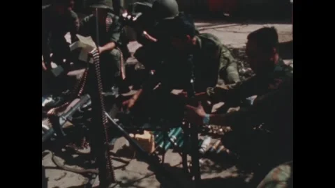 SAIGON - 1968: Weapons display - Soldiers arrange captured weapons Stock Footage 344483089