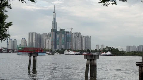 Saigon Pearl Tower. Cargo Boat sailing the river. Ho Chi Minh, Vietnam. Stock Footage 115065349