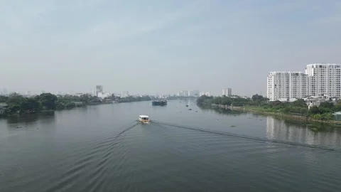 Saigon River with a ferry sailing away from the camera. Stock Footage 262499118