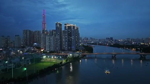Saigon Skyline at Twilight with Landmark 81 and Riverside Bridge Stock Footage 340972387
