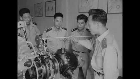 SAIGON, VIETNAM - 1957: Casing explainer - An instructor talks over a casing Stock-Footage 344004234