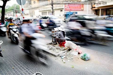 Saigon in Vietnam. Vietnamese culture,people,city life, motorbikes. Stock Photos
