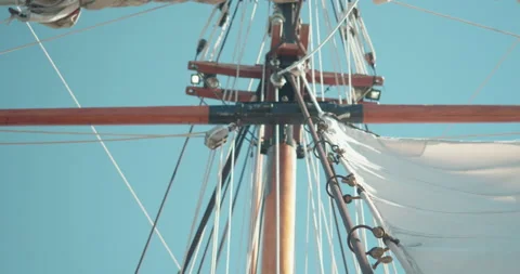 Sail of an ancient ship pulled up by a sailor Video stock 142807701