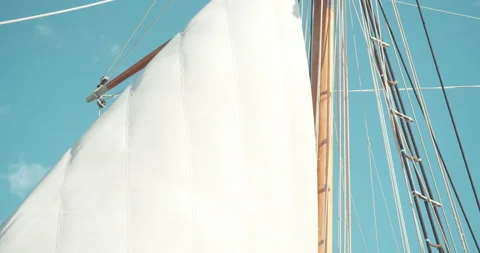 Sail of an ancient ship pulled up by a sailor Stock Footage 142808084