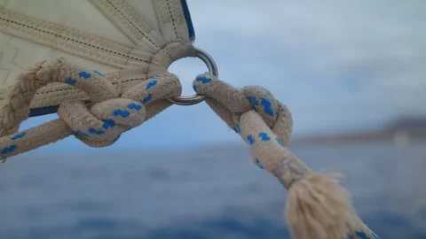Sail attached to Kicking Strap Rope with Marine Knot Sheet Weighs on Bow Pullpit Stock Footage 113409389