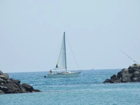 Sail boat between the rocks Stock Photos