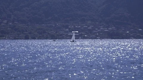 Sail Boat Crossing a Lake Stock Footage