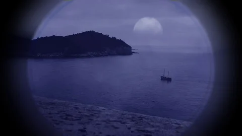Sail boat at dusk viewed through the lens of a telescope 스톡 동영상 74135273