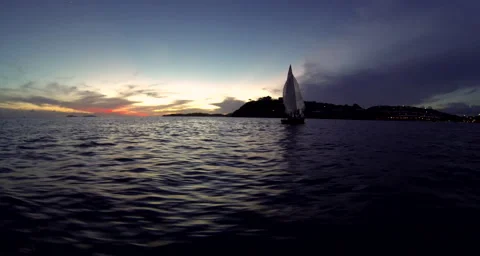 A sail boat passing St. Thomas at the United States Virgin Islands Stock Footage 42848820